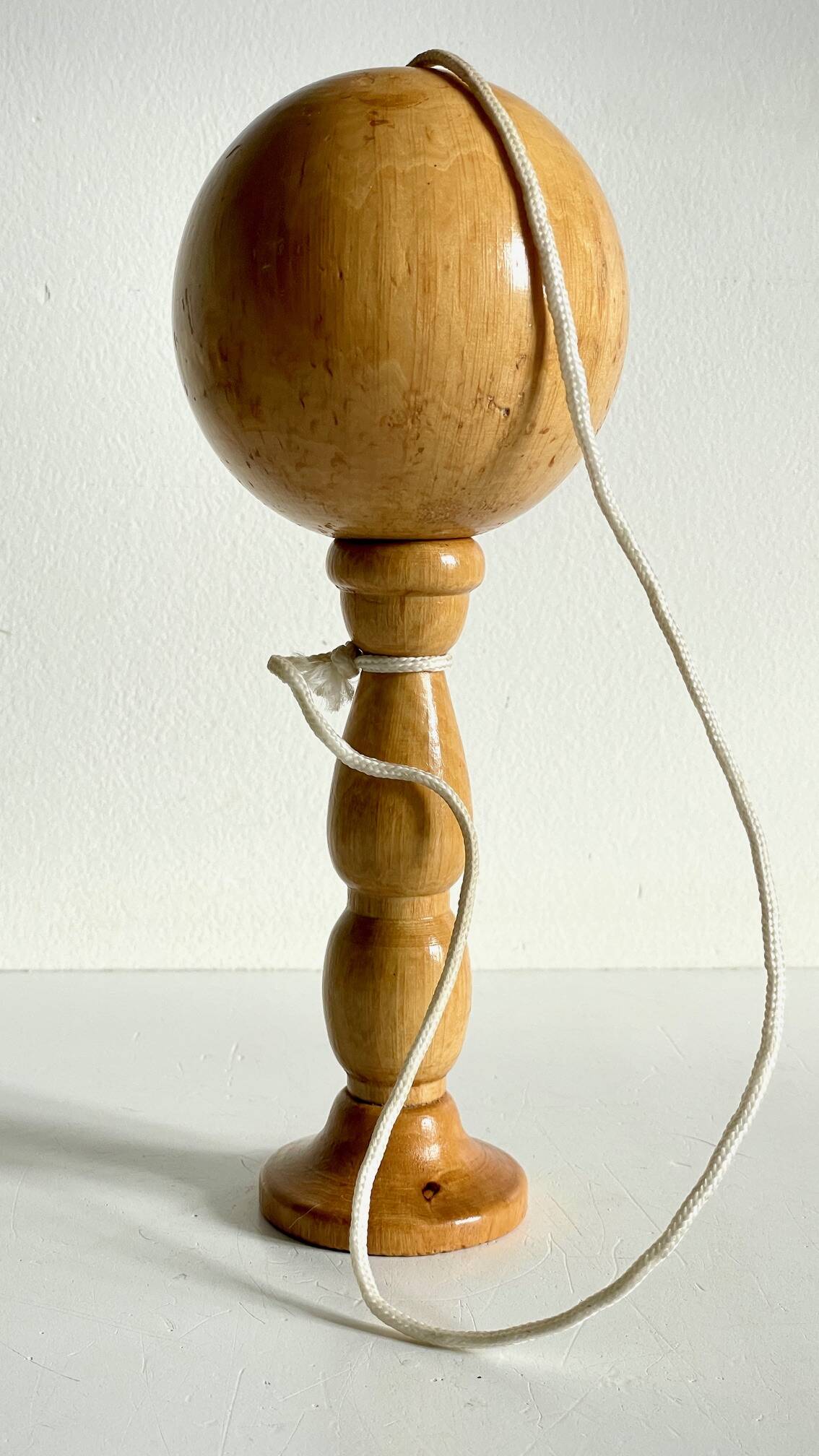 Vintage wooden cup-and-ball toy
