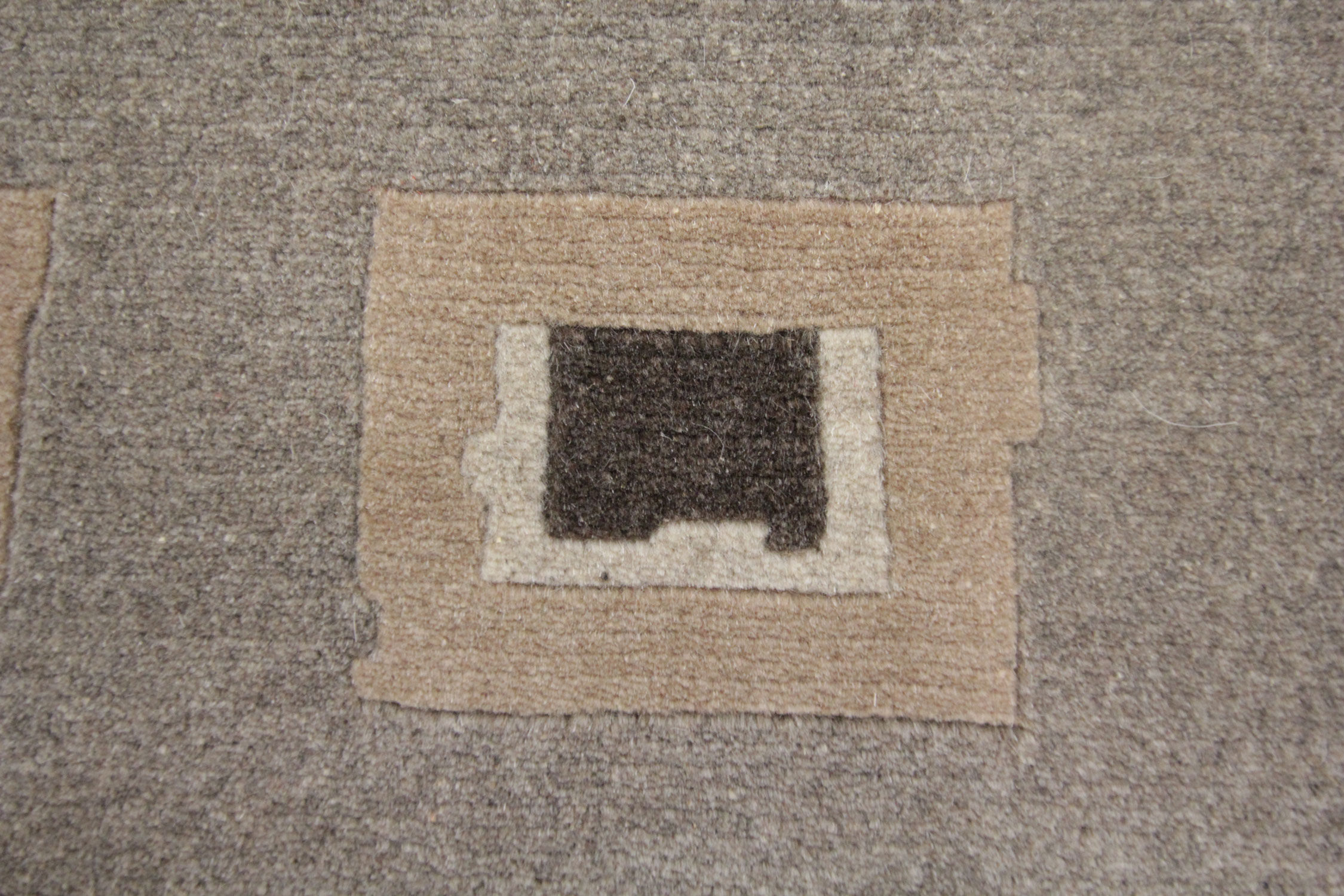Handwoven matt cream wool carpet 61x91 cm