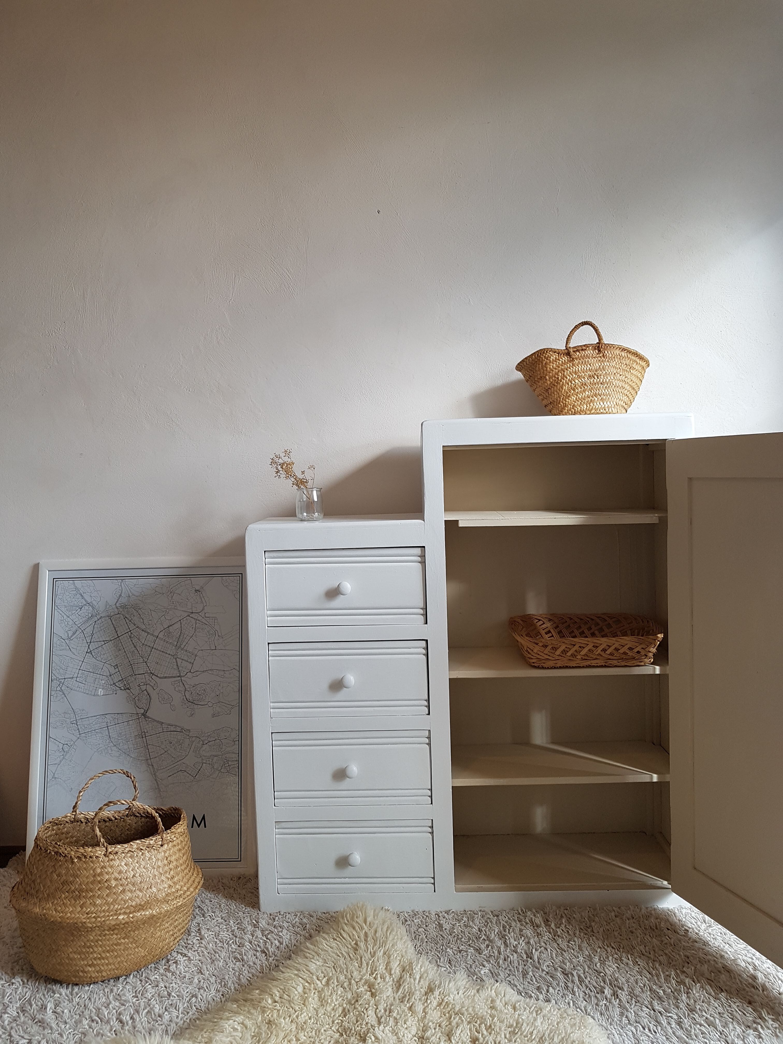 Old white asymmetrical chest of drawers