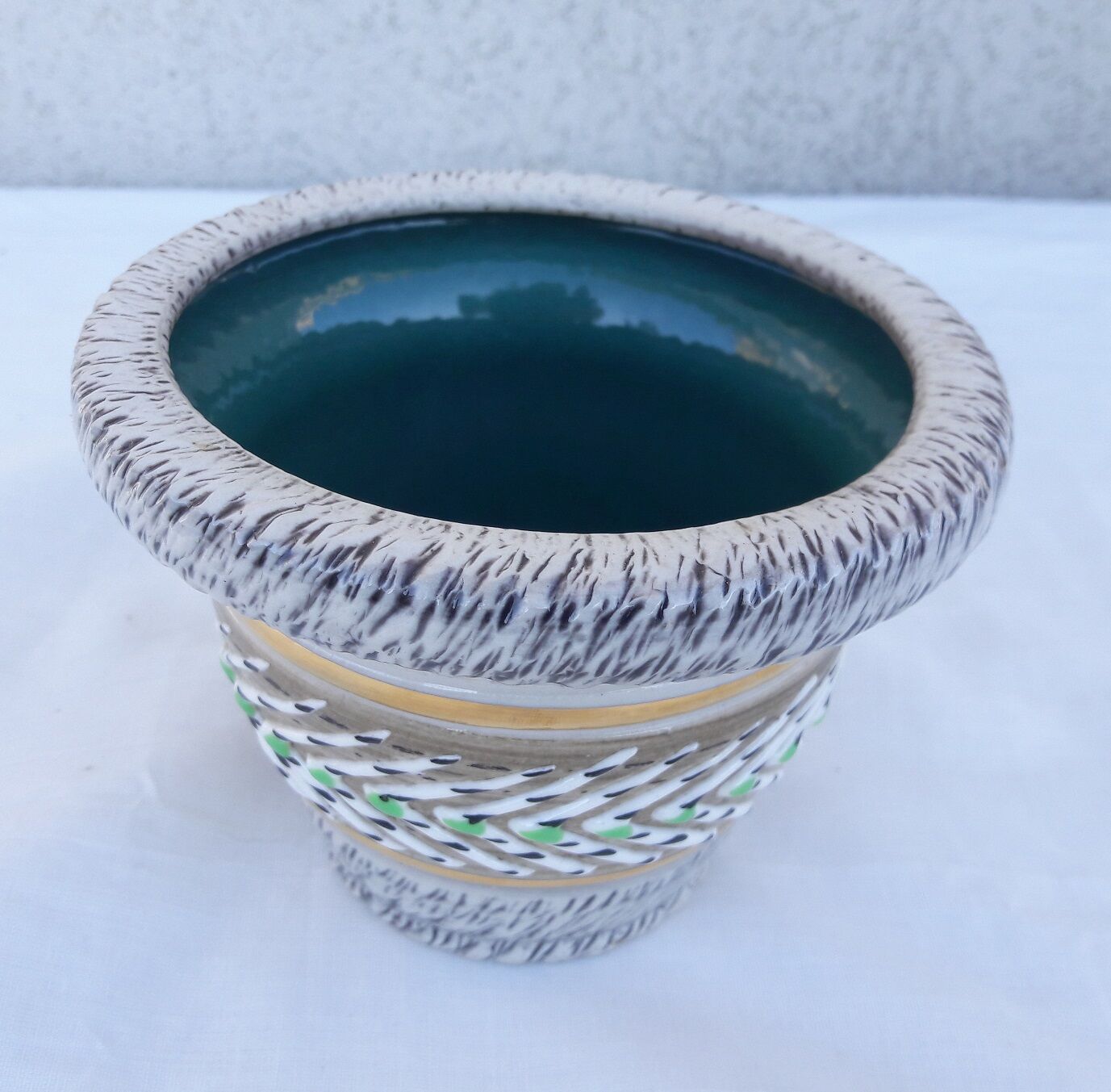 Signed sandstone pot cover