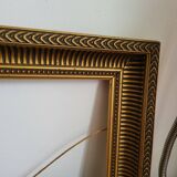 Frame with channels in wood and gilded stucco