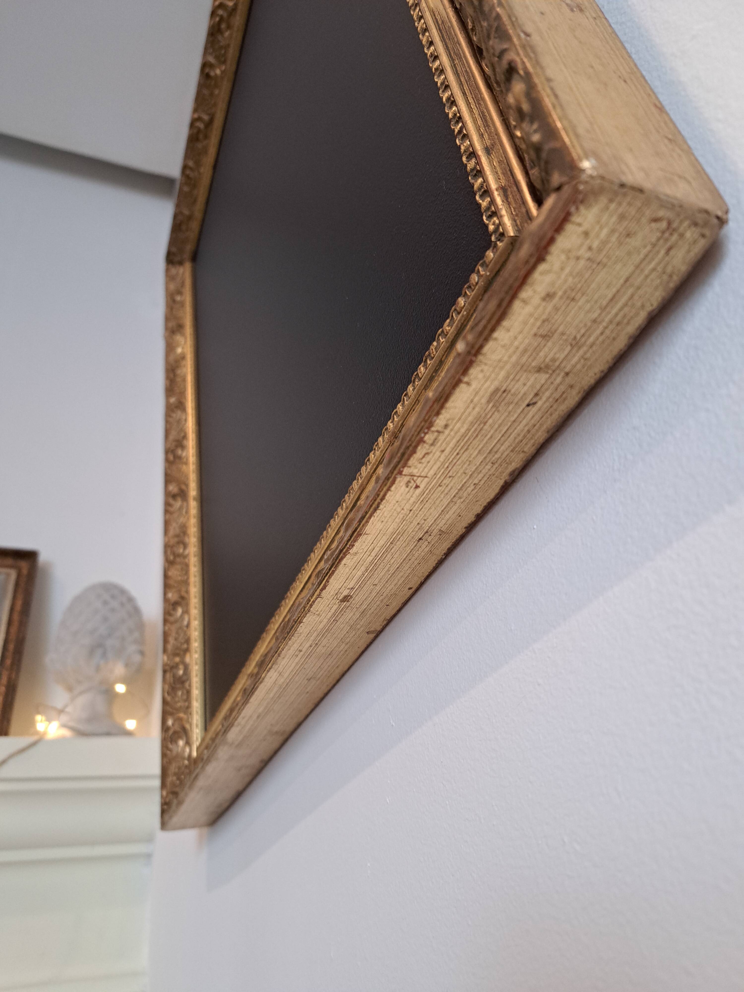 Slate table framed in gold leaf style