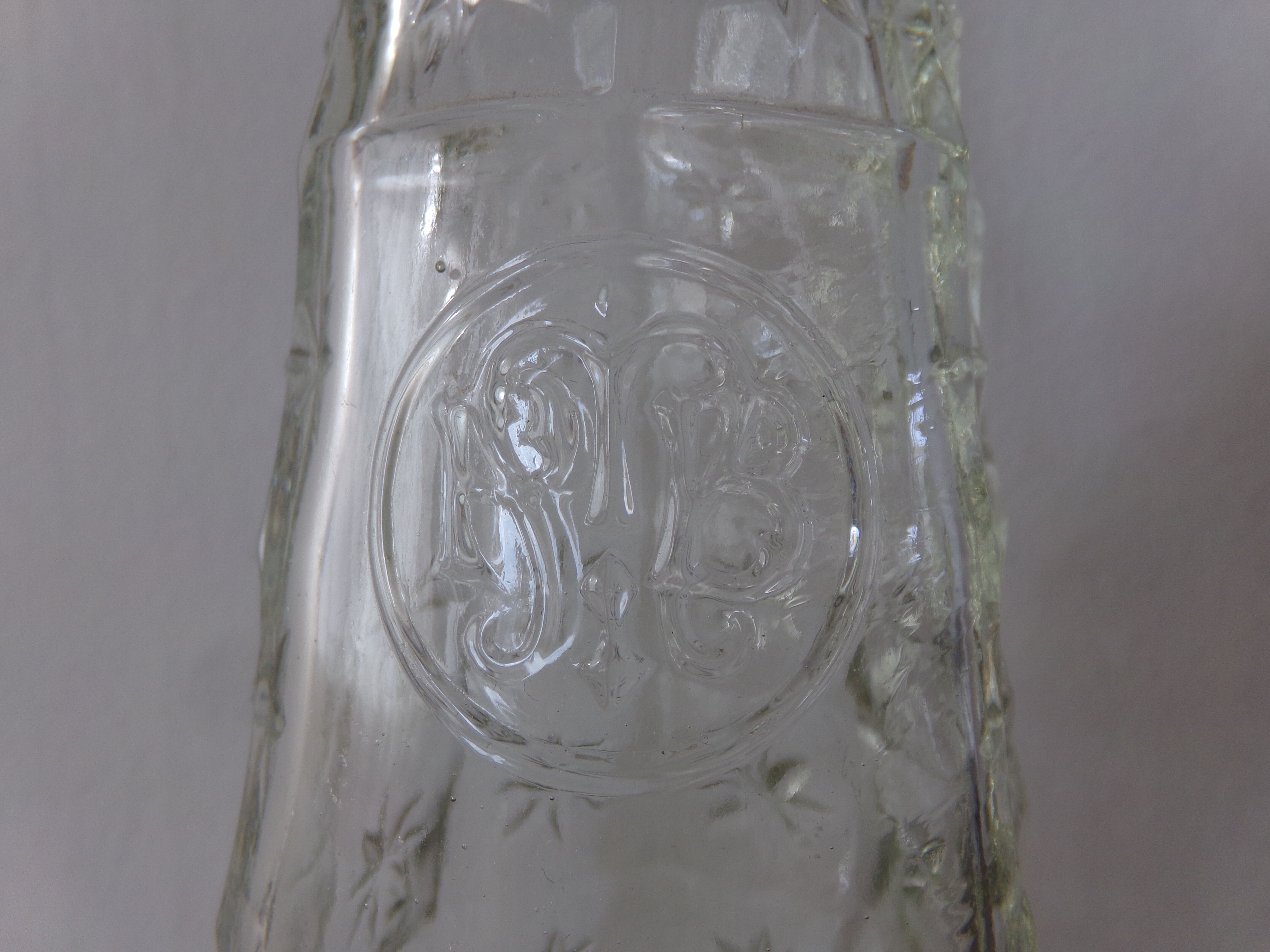 Chiseled glass bottle