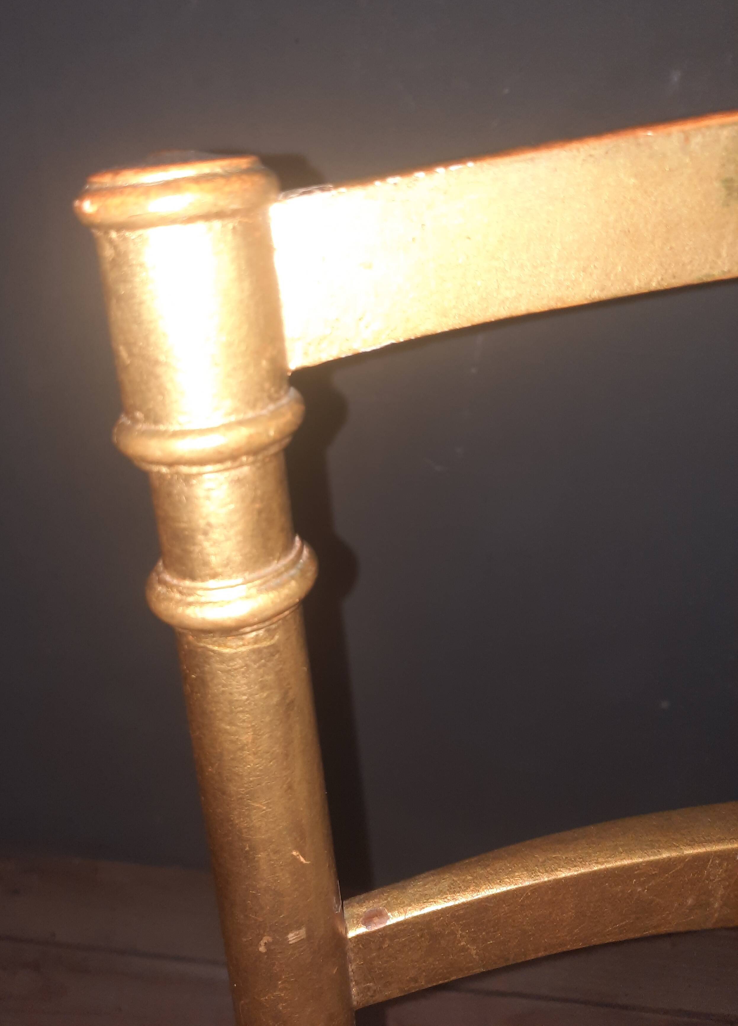 Pair of upholstered chairs in gilded wood