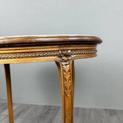 Oval guéridon table in carved wood and marble, Louis XVI style, 19th century.
