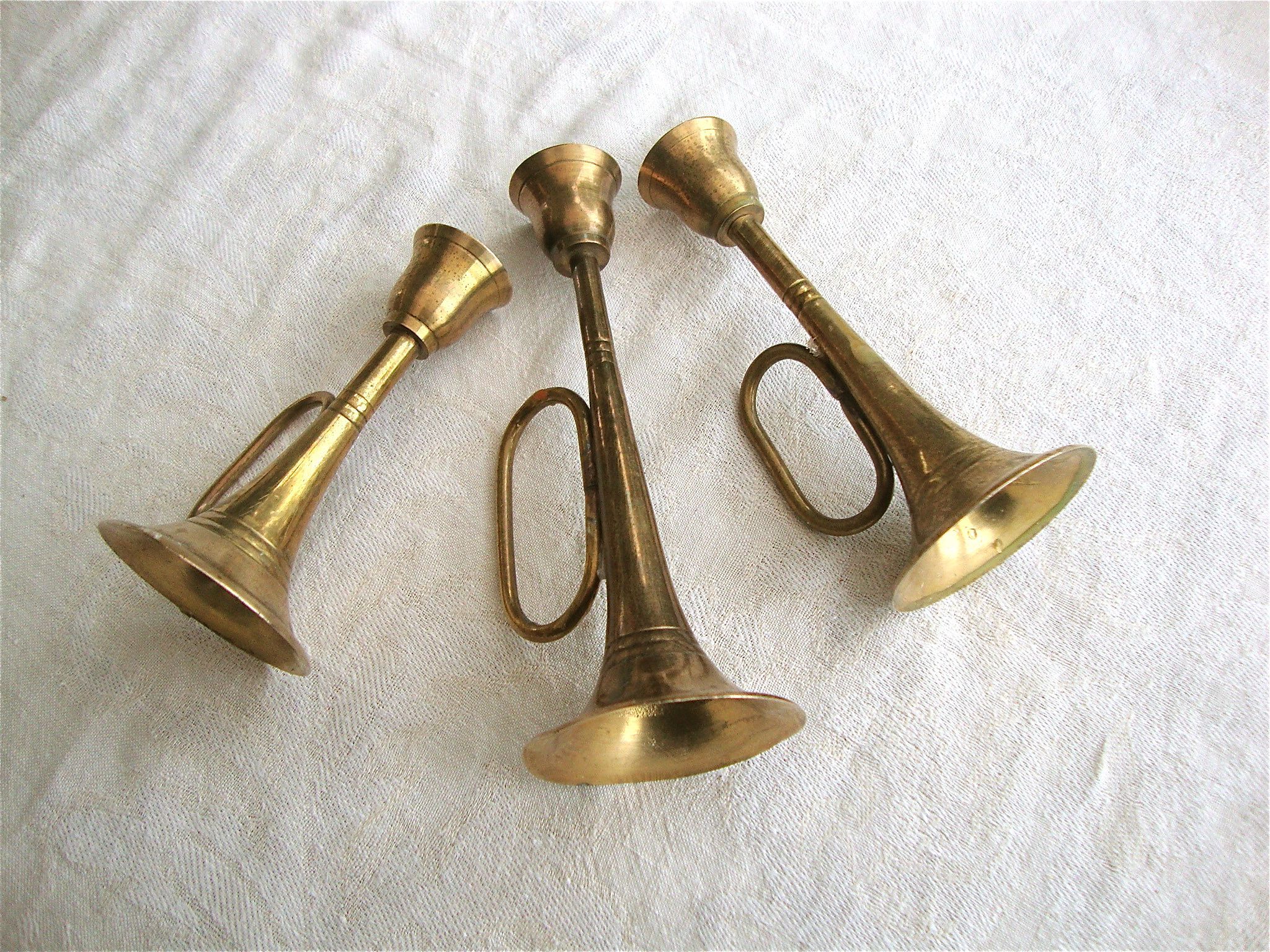 3 brass trumpet candlesticks