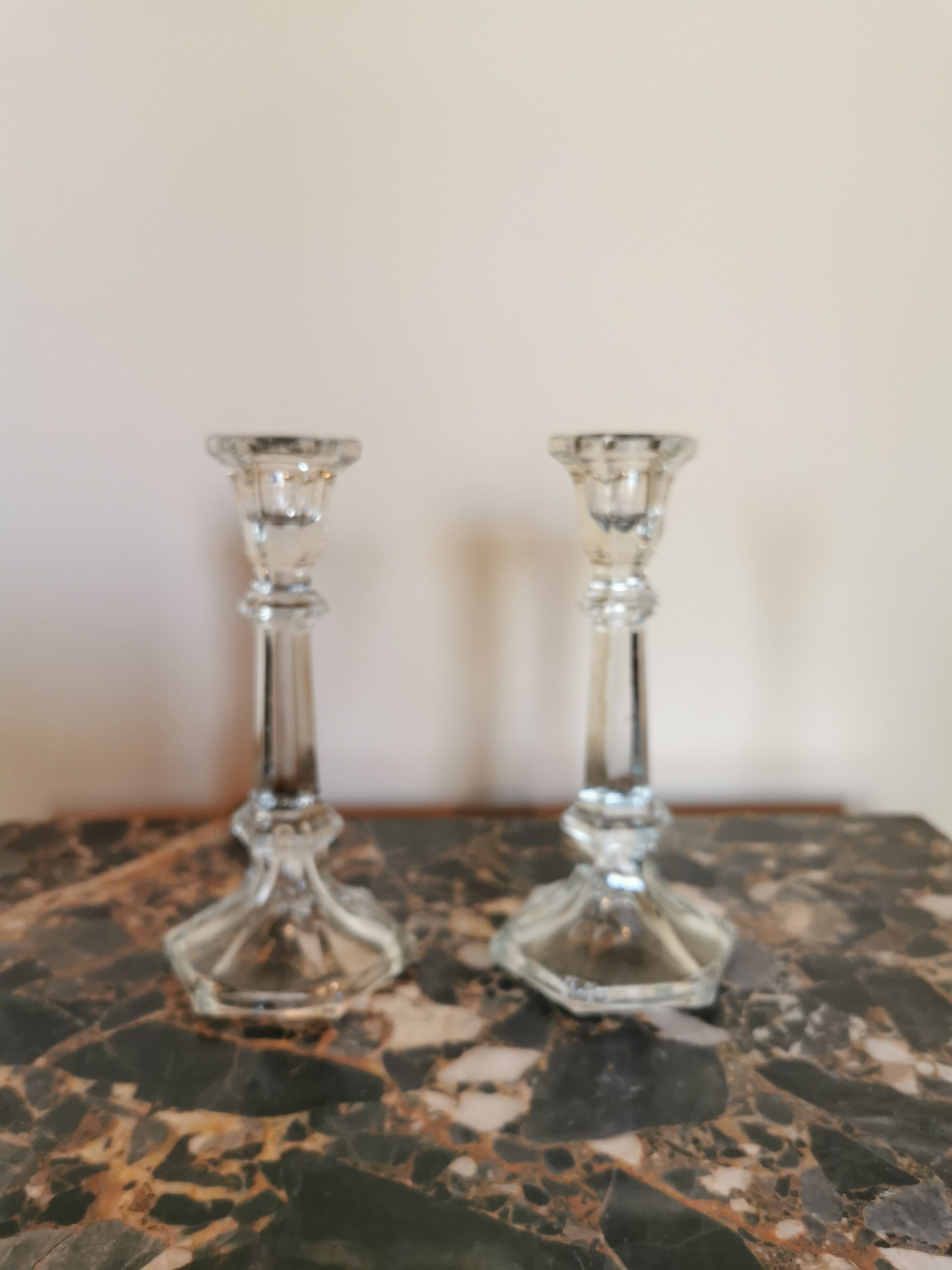 Pair of antique candle holders in transparent glass