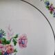 7 mismatched antique dessert plates accompanied by a pie dish