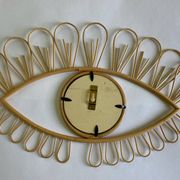 Rattan eye mirror