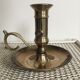 Old brass candlestick called "rat tail"