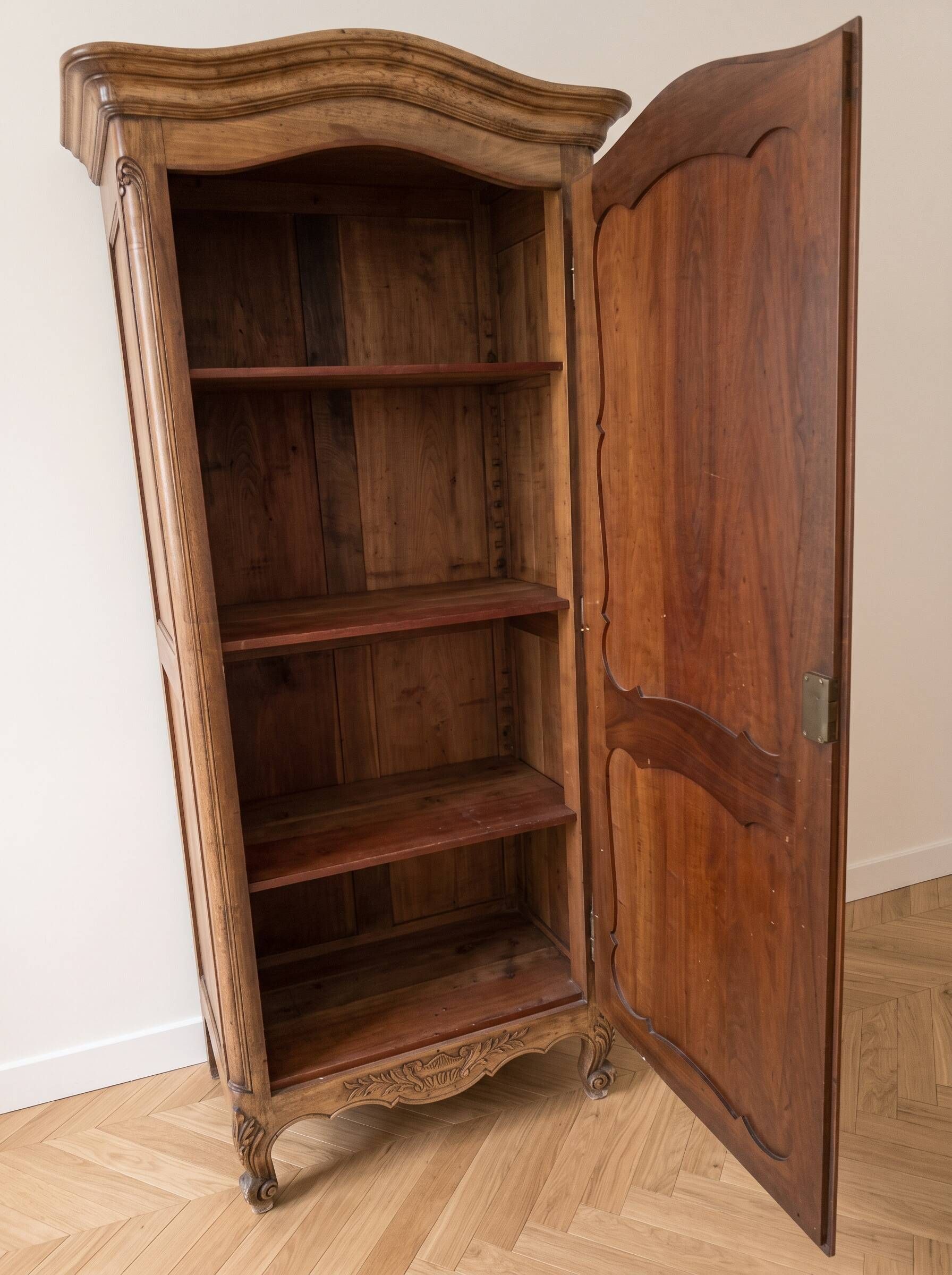Antique wardrobe in classic style made of solid wood.