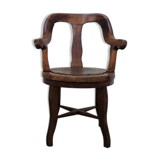 Antique oakwood barber armchair