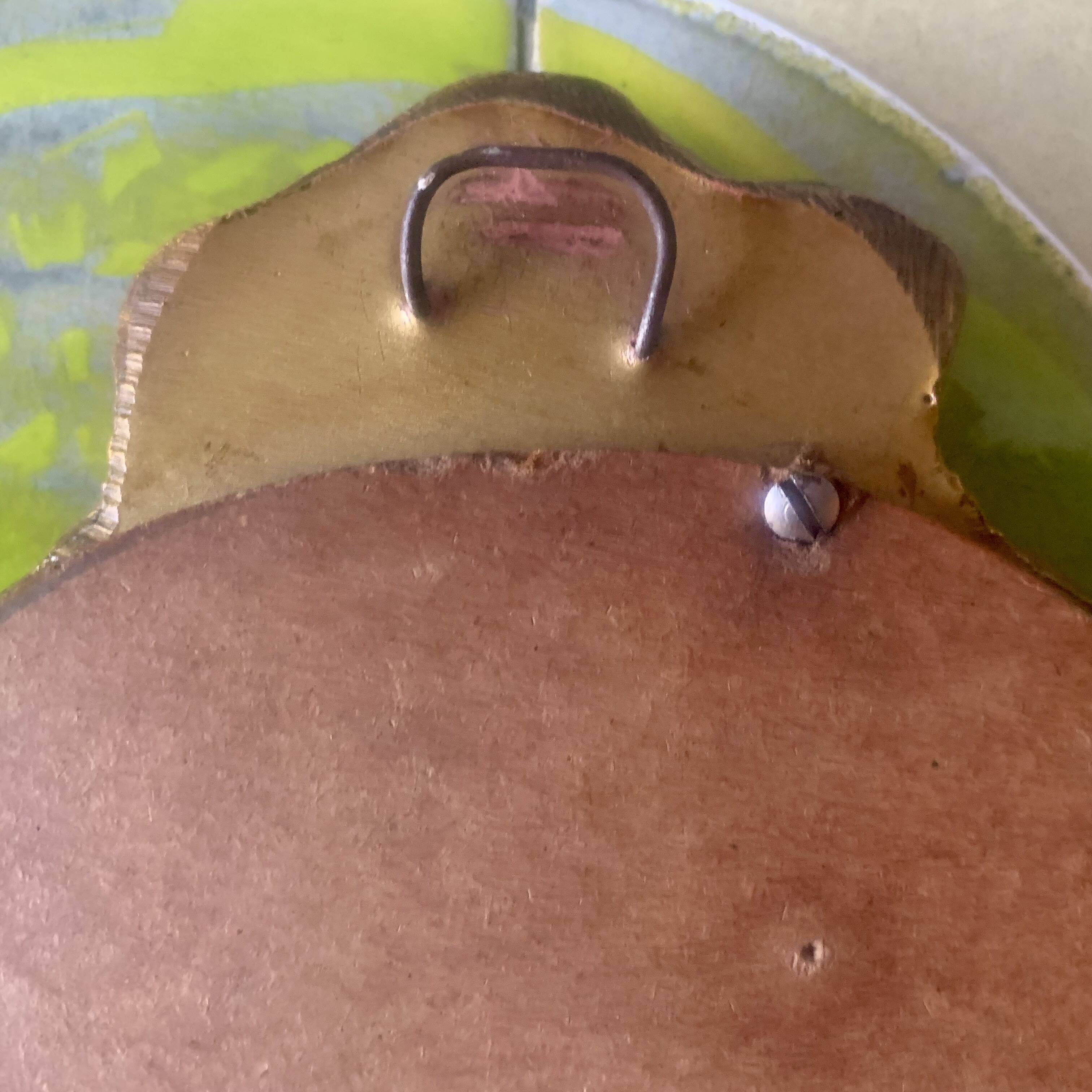 Small vintage oval wall mirror in varnished gold resin