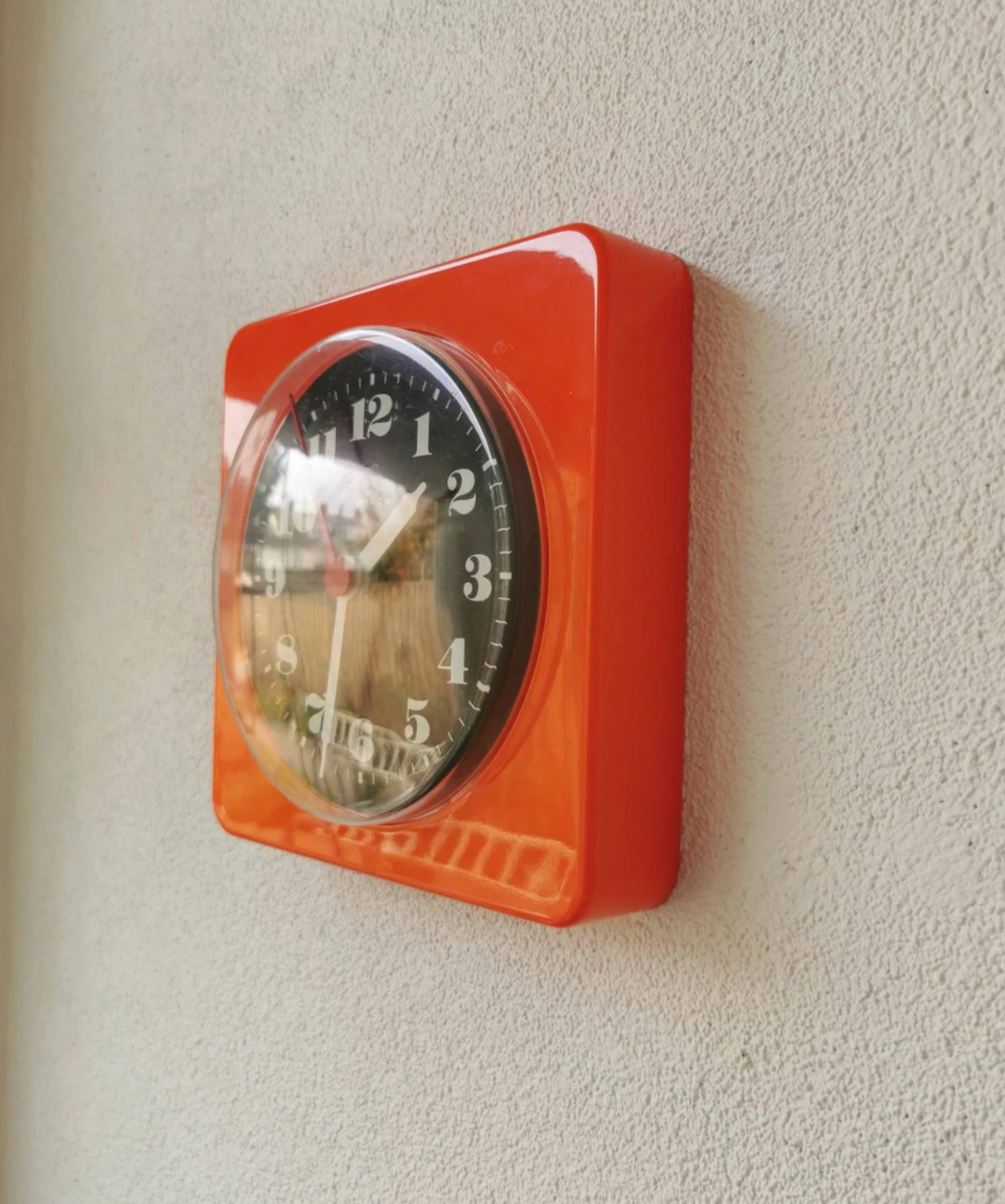 Vintage orange wall clock made of Inproco plastic, 1970