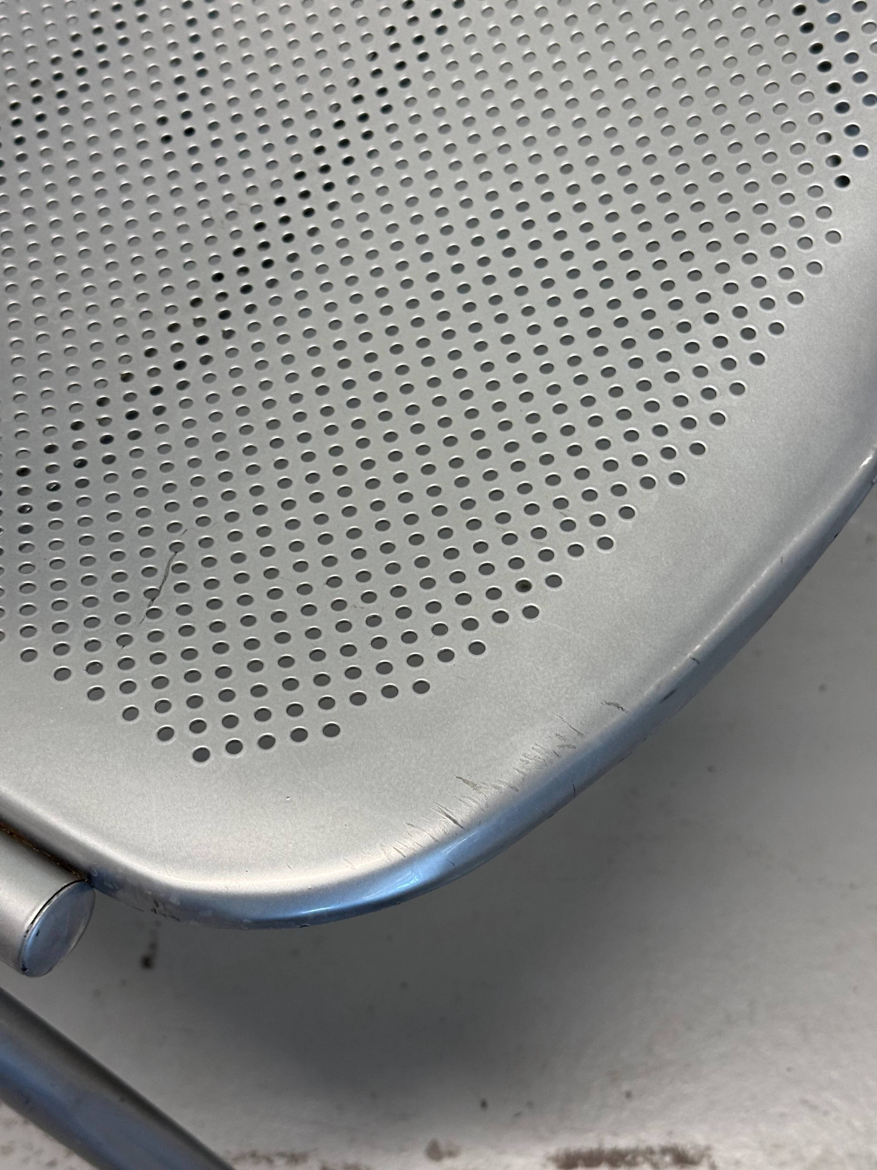 Vintage Sokoa stackable chairs, brutalist perforated metal chairs.