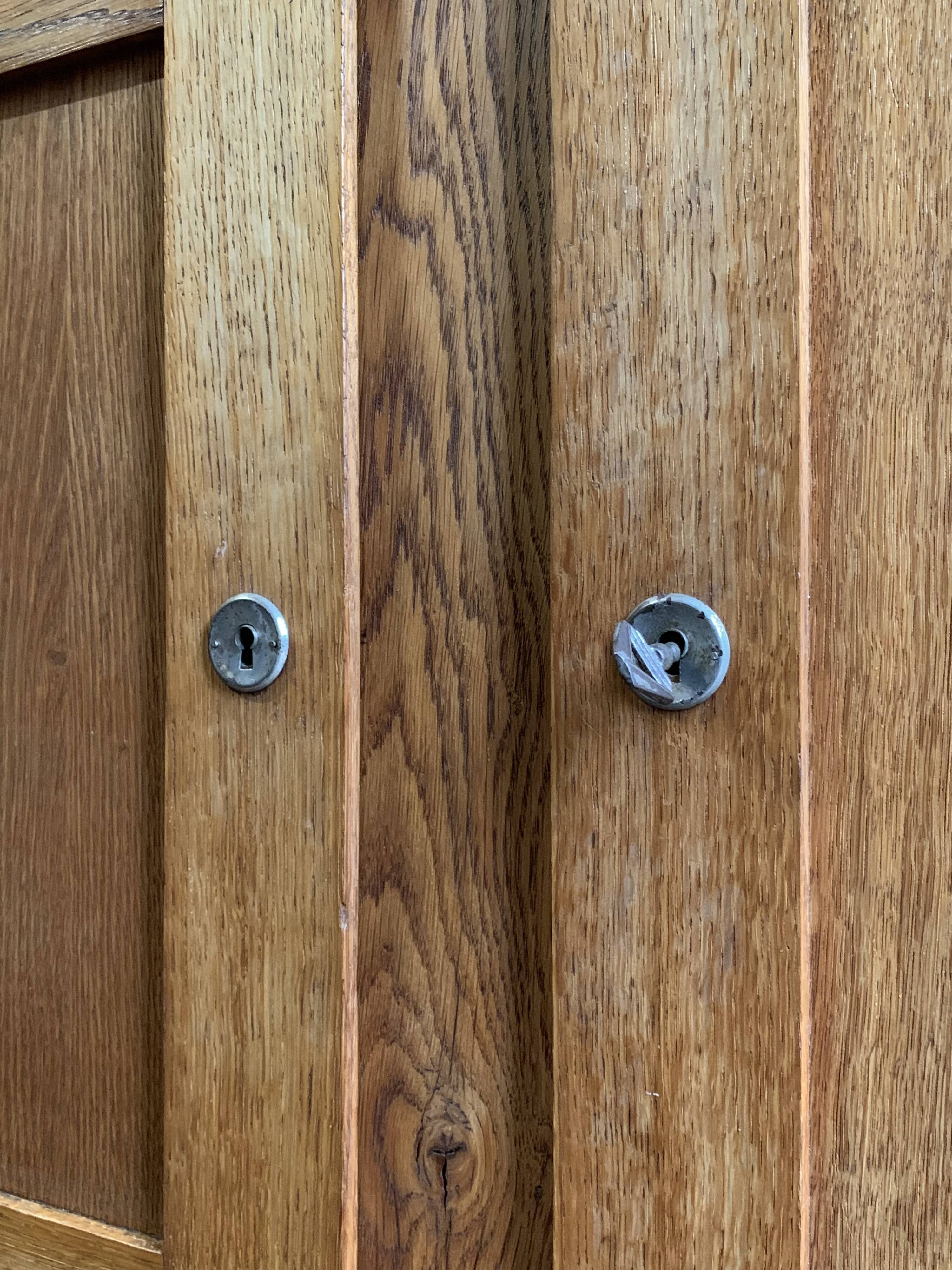 Solid oak compass foot cabinet René Gabriel 1945