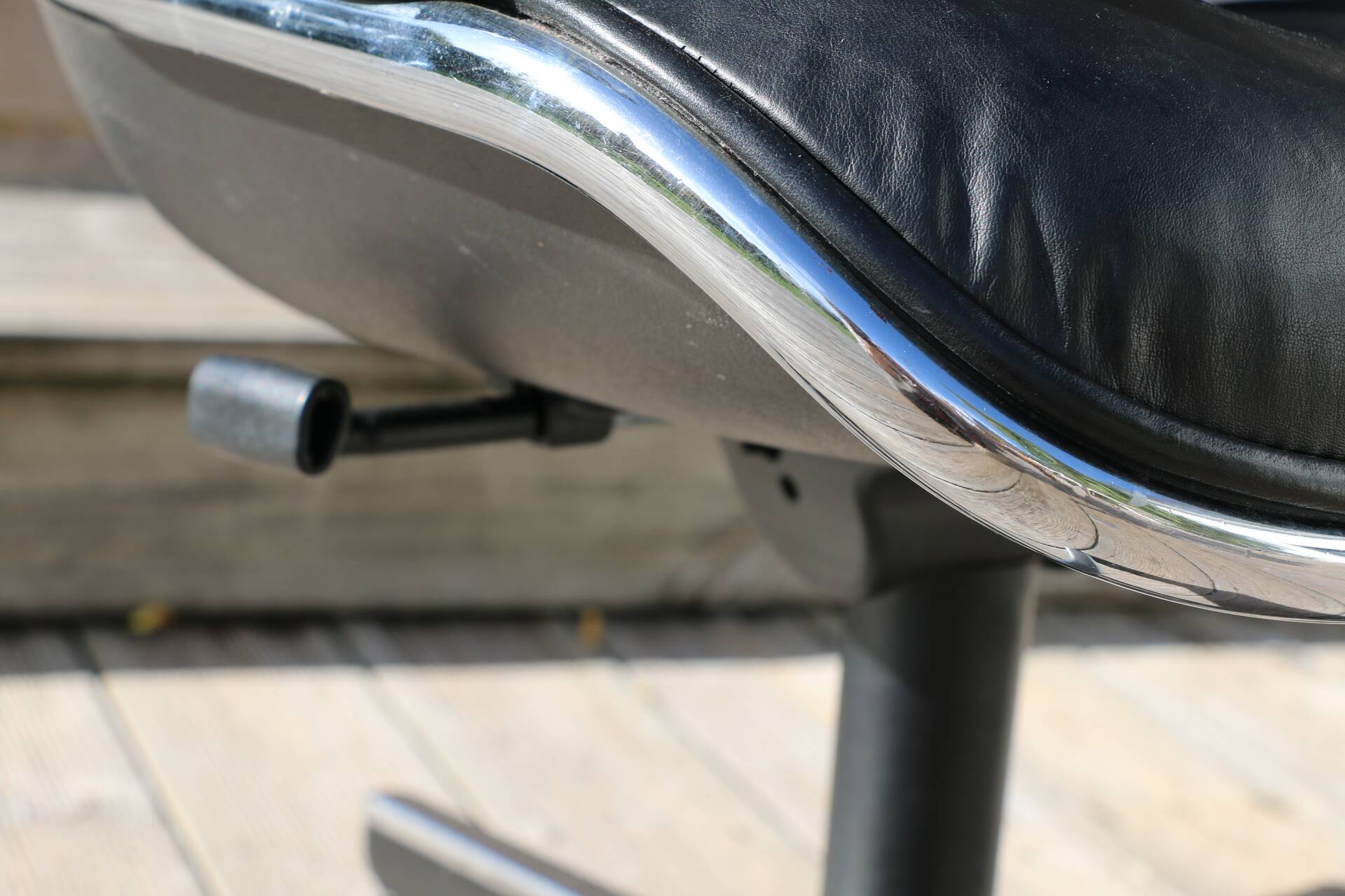 POLLOCK black leather reclining armchair with casters