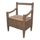 Antique armchair in raw wood