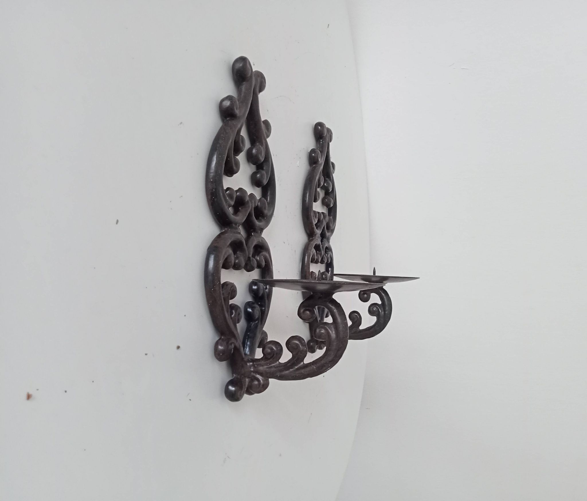 Antique wall candle holder in enamelled cast iron
