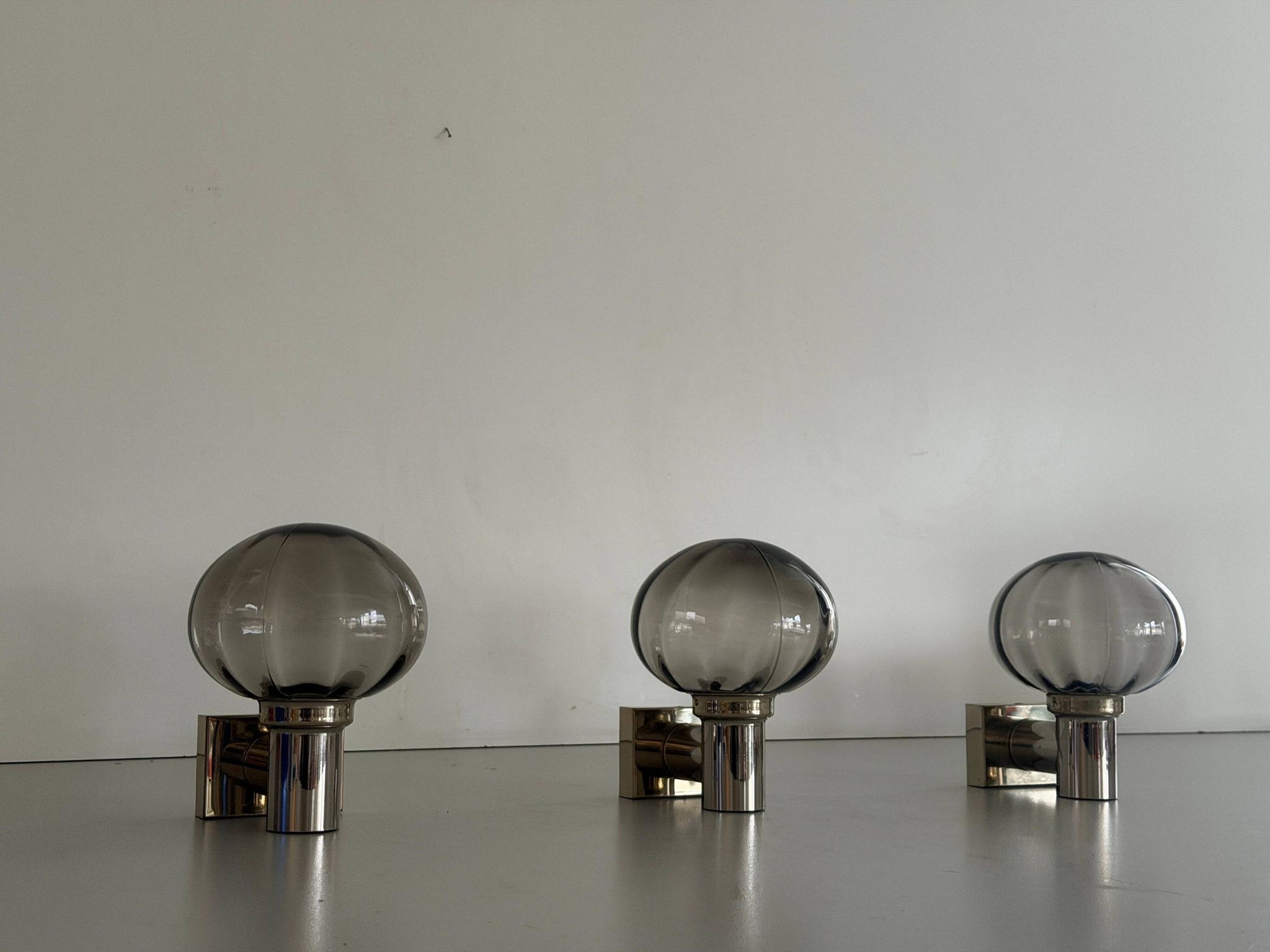 Set of 3 grey glass and chrome wall lights from the mid-century by N Leuchten, 1960s, Germany.