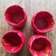 Set of 4 red tulip bowls by Villeroy & Boch.