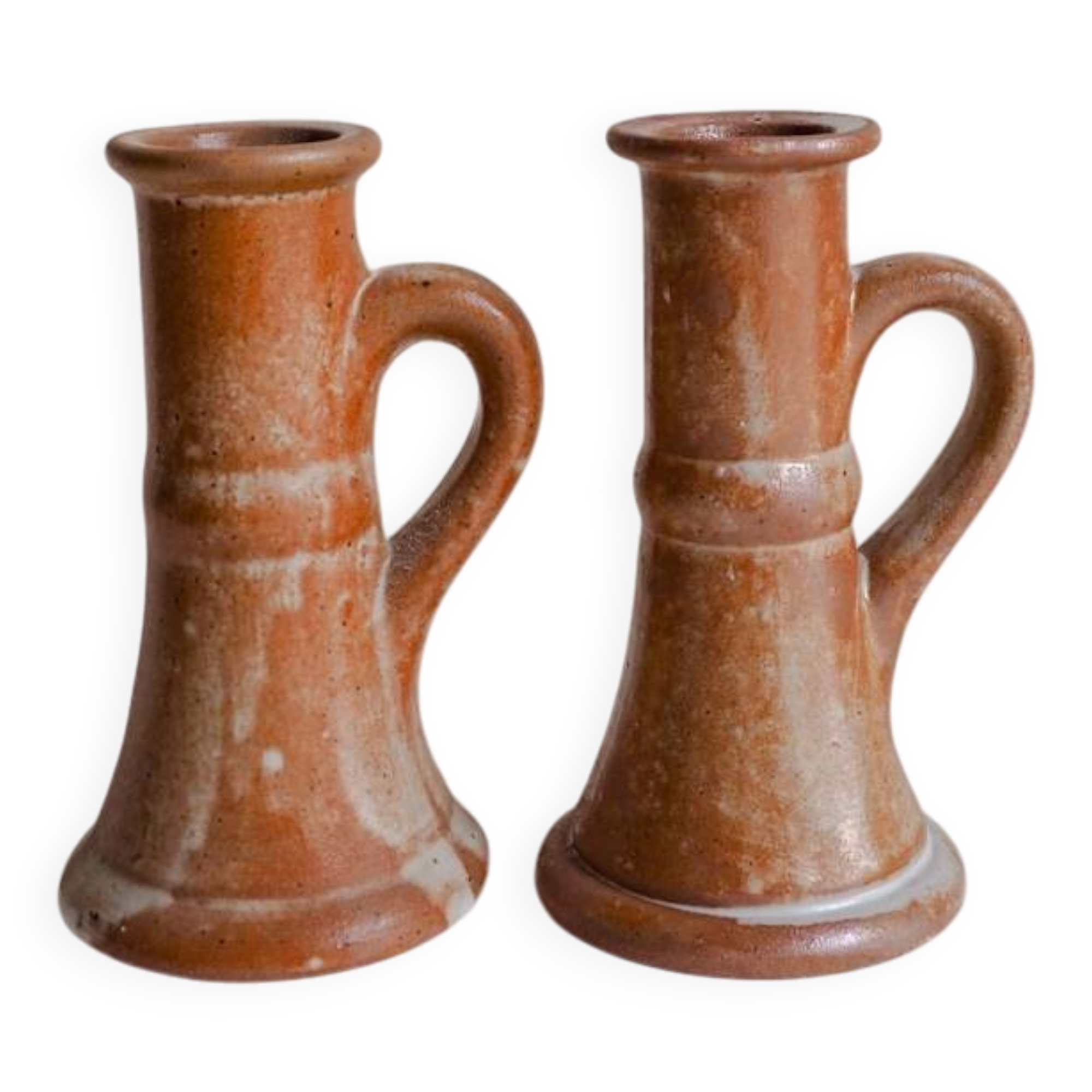 Set of two terracotta candle holders.