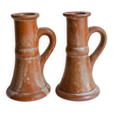 Set of two terracotta candle holders.