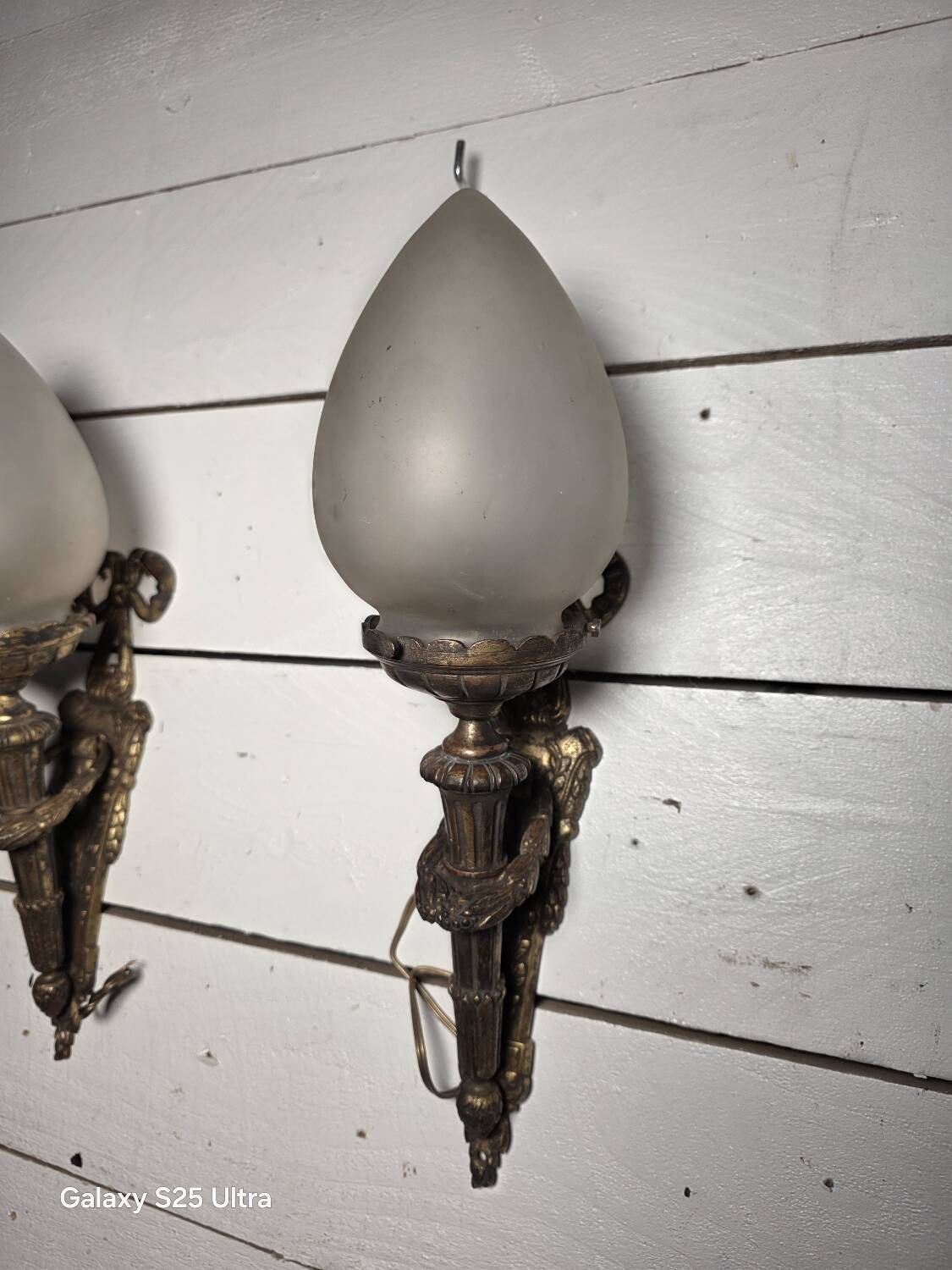 Pair of torch wall lights in Louis XVI style in 19th-century bronze.