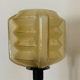 Table lamp with a yellow shade in vintage art deco style