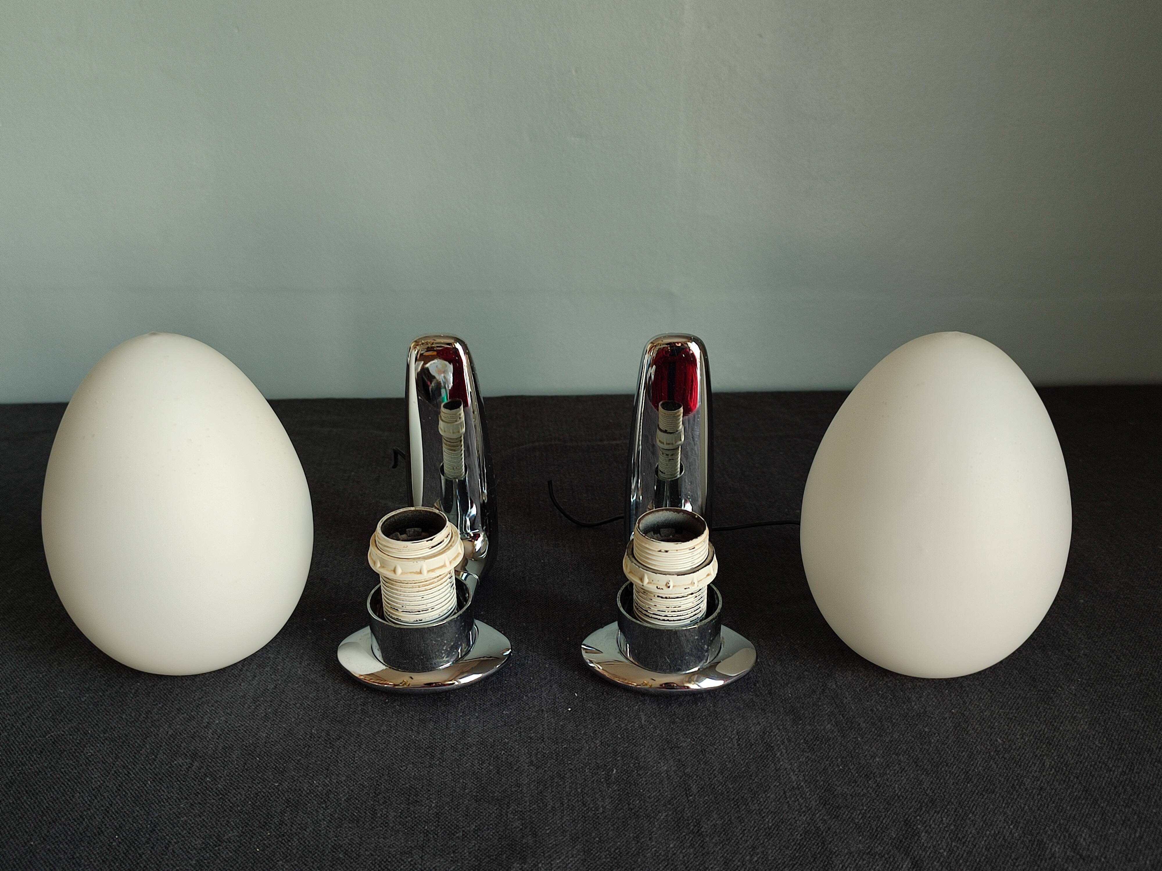 Pair of ouefs sconces in opaline and vintage chromed metal