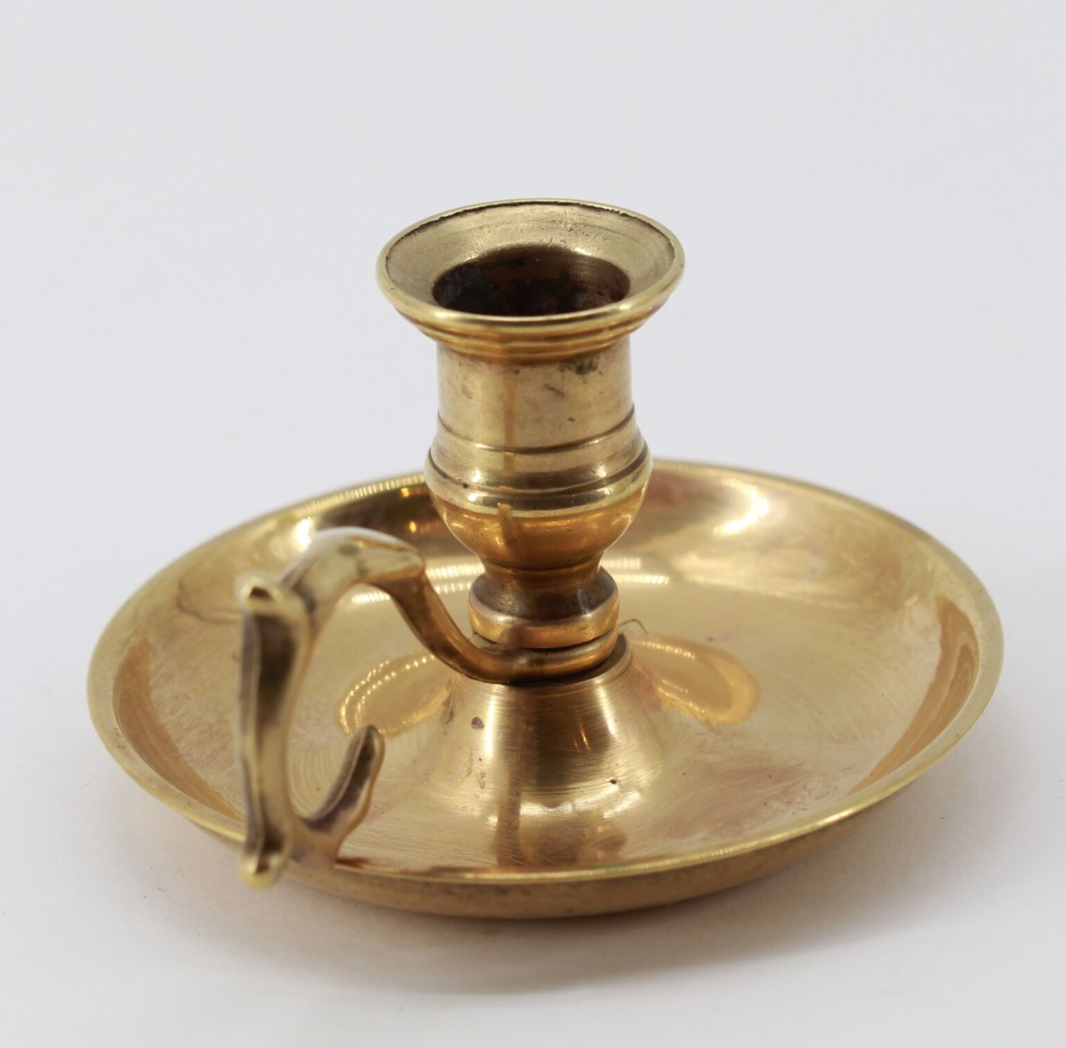 Old brass hand candle holder