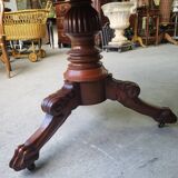 Round pedestal table with marble top and mahogany tripod from the 19th century