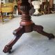 Round pedestal table with marble top and mahogany tripod from the 19th century