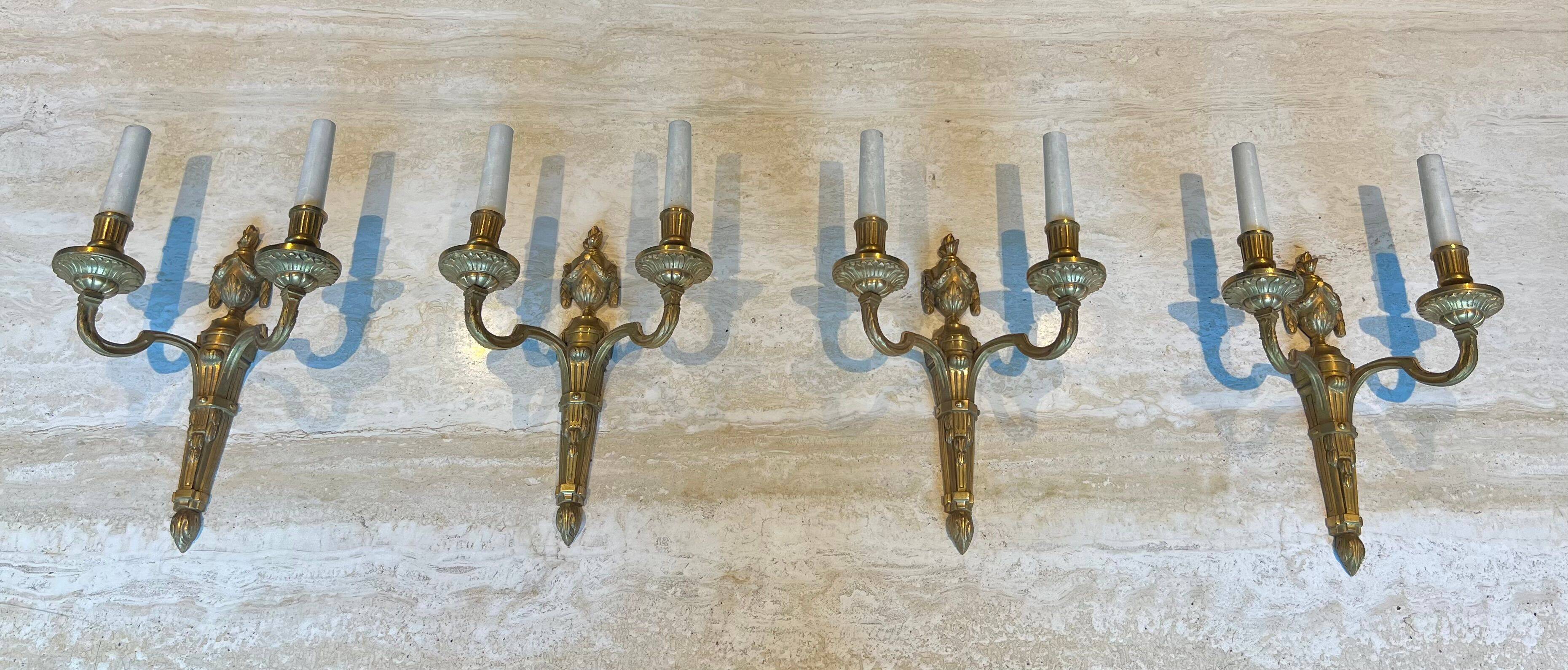 Set of 4 bronze wall lights in Louis XVI style.