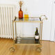 Glass and gold metal wheeled serving table 1960