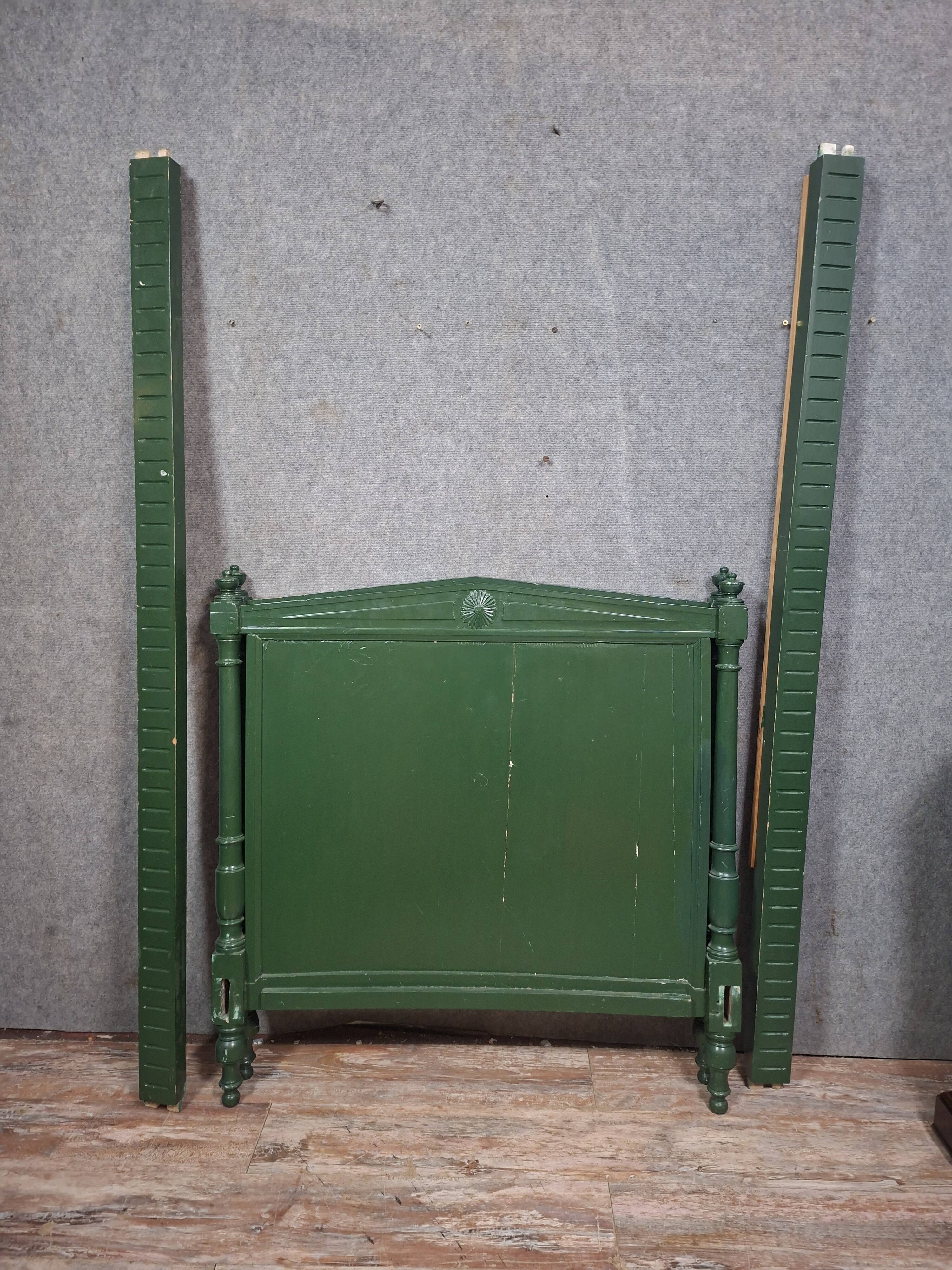 Directoire style bed in painted green wood.