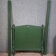 Directoire style bed in painted green wood.