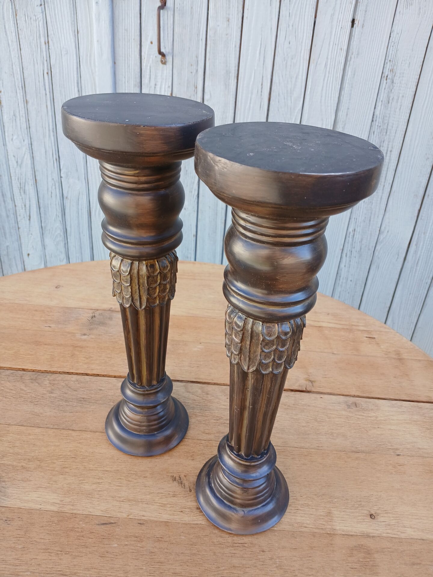 2 carved wooden candlesticks