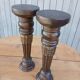 2 carved wooden candlesticks