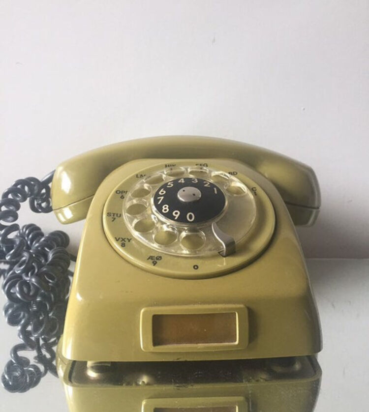 Vintage mustard green rotary telephone