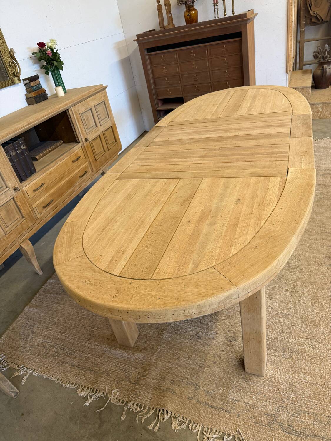 Oval farmhouse table in solid oak with extensions.