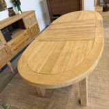 Oval farmhouse table in solid oak with extensions.