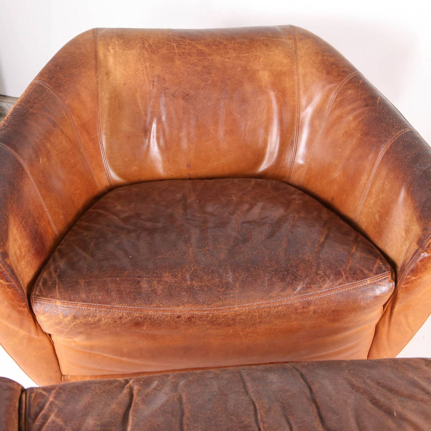 Grands fauteuil et ottoman en cuir