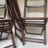 Set de quatre chaises pliantes en bois et cannage