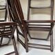 Set de quatre chaises pliantes en bois et cannage