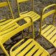 Lot of 11 yellow metallic bistro chairs from the 1950s