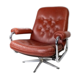 Armchair upholstered with red leather and frame of metal, of danish design from the 1960s