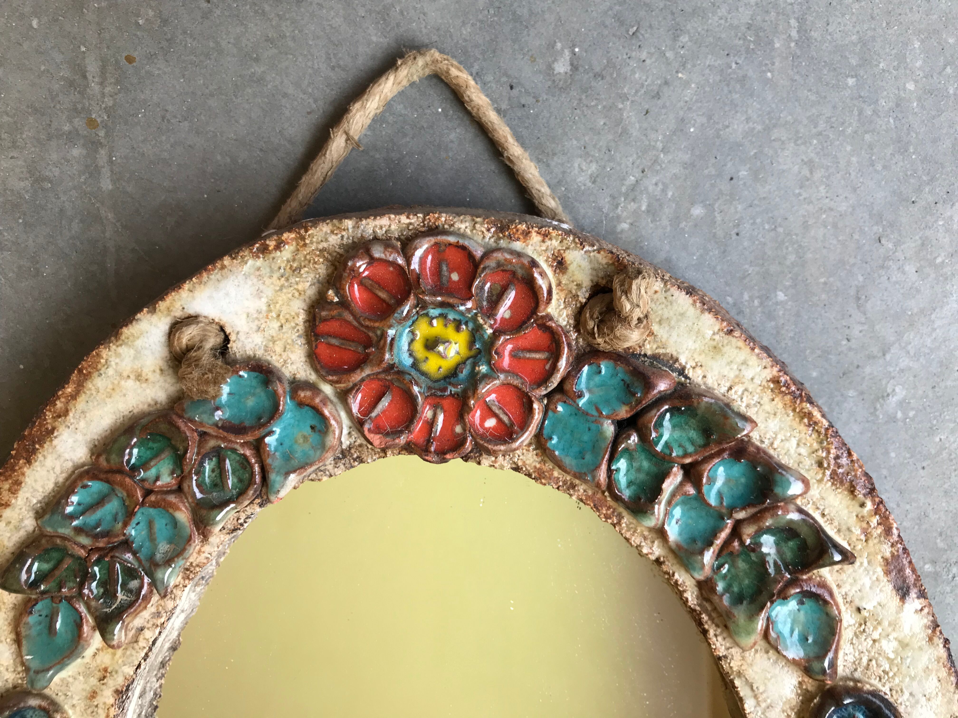 Ceramic mirror decorated with flowers, circa 1960 25x40cm