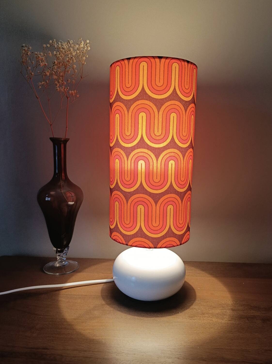 Two lamps with a seventies psychedelic wave print.
