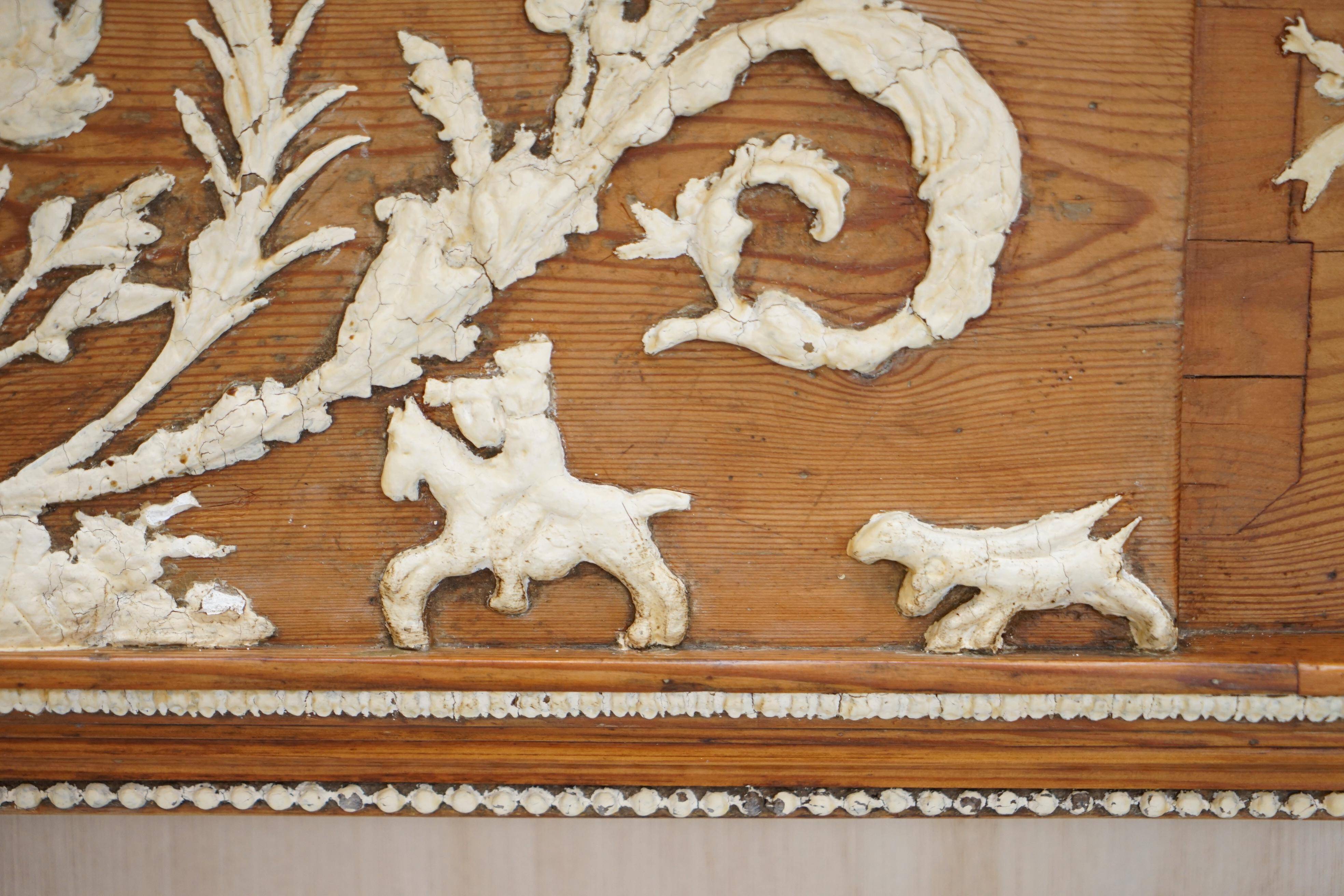Victorian antique fireplace in tarred pine and sculpted gesso.